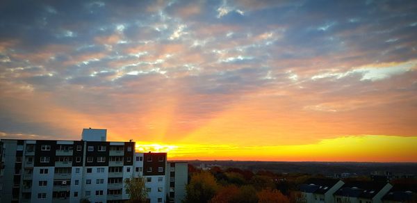 Buildings against sky during sunset