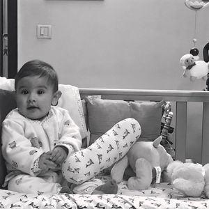 Portrait of boy sitting at home