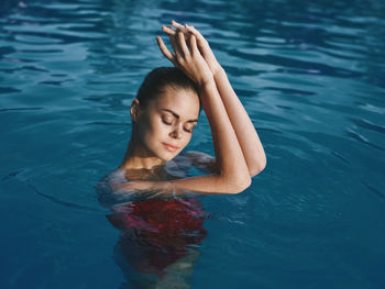 Woman swimming in pool