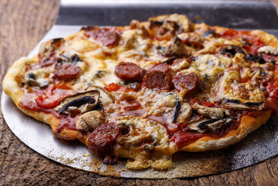 Close-up of pizza in plate on table