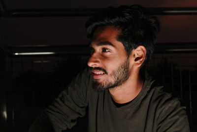 Portrait of young man looking away