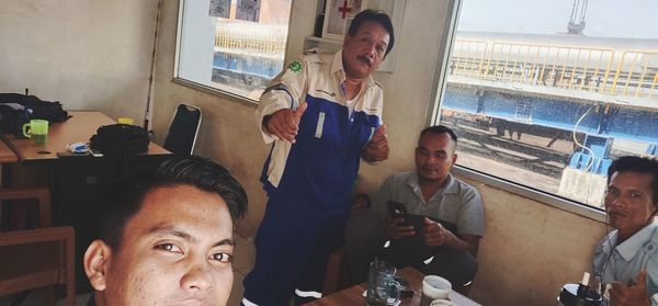 Portrait of people sitting in restaurant