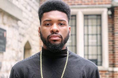 Portrait of bearded young man standing outdoors