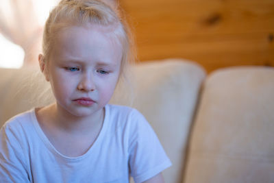 Little girl cries from grief and resentment.