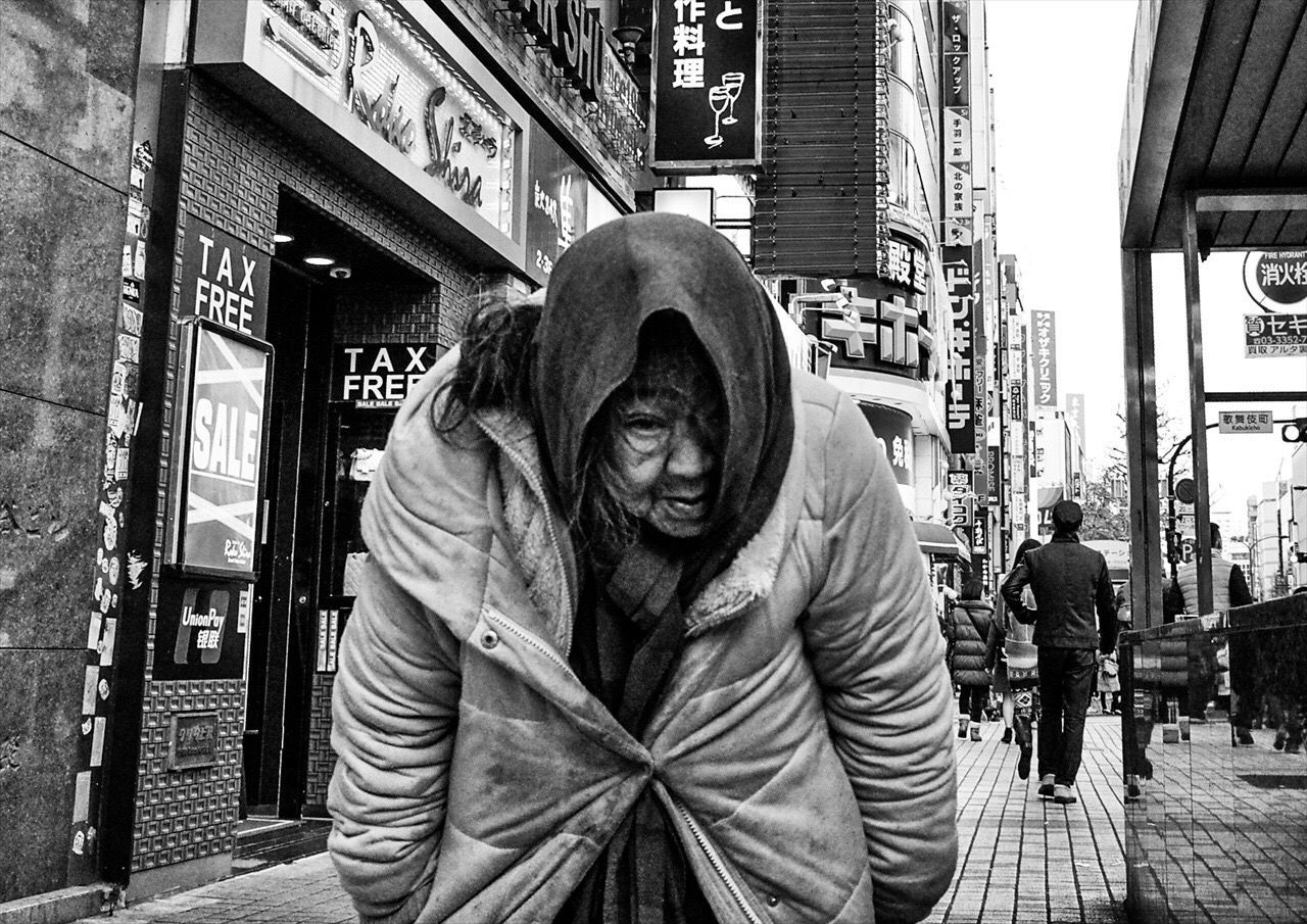 building exterior, architecture, built structure, lifestyles, city, men, casual clothing, leisure activity, human representation, street, building, city life, day, outdoors, standing, front view, young men