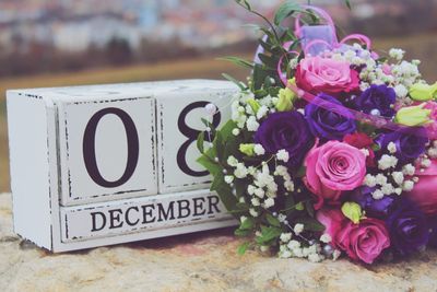 Close-up of rose bouquet on wall