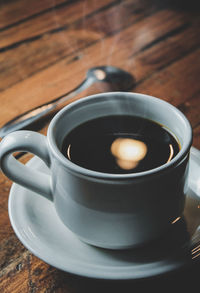 High angle view of coffee cup on table