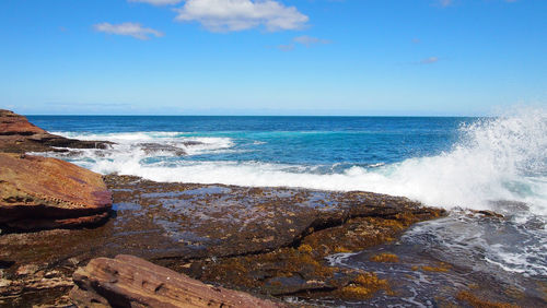 Scenic view of sea against blue sky