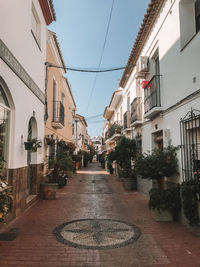 Alley amidst buildings in city