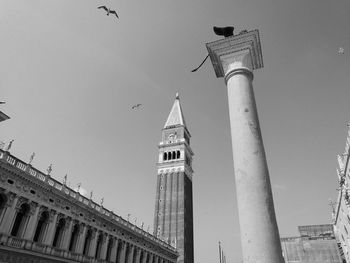 Low angle view of clock tower against sky