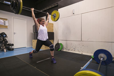 Woman weightlifting in gym