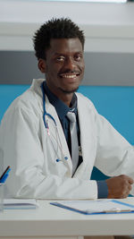 Portrait of doctor standing in clinic