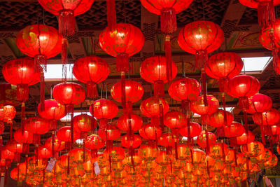 Red lantern hanging in illuminated lanterns