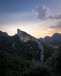 Scenic view of landscape against sky during sunset.