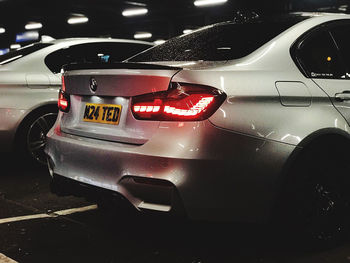 Close-up of car on street at night