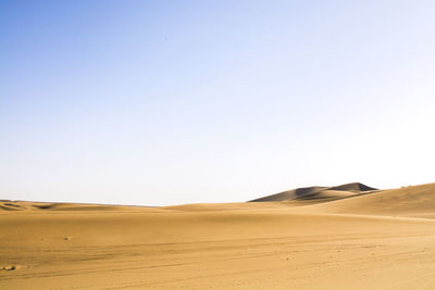 Scenic view of desert against clear sky