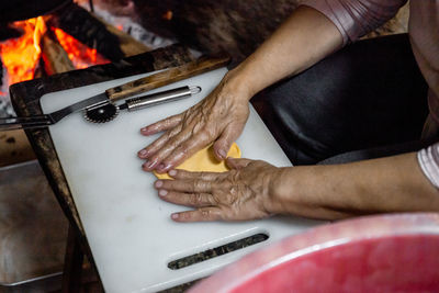 The preparation of a traditional food, sweet fritter called filhós from portugal. christmas time. 