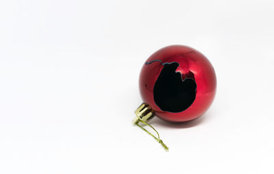 Close-up of strawberry over white background