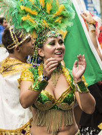 Portrait of young woman dancing in traditional clothing