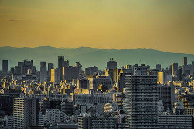 Cityscape against sky during sunset