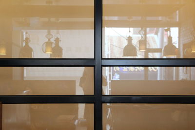 Reflection of people on glass window