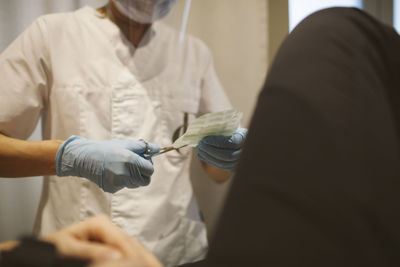 Doctor preparing bandage