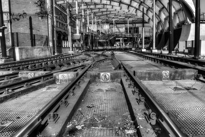 Train and tram tracks leading to victoria train station manchester