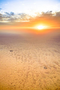 Scenic view of landscape against sky during sunset