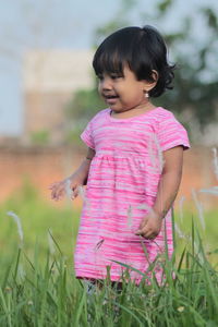 Cute girl lying on field