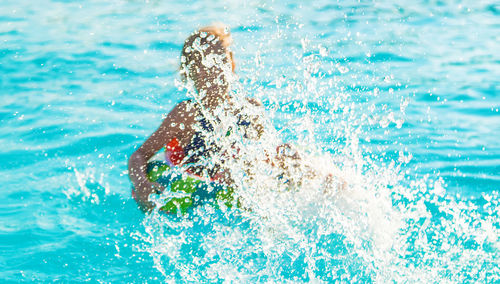 Close-up of water splashing in swimming pool