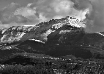 Scenic view of snowcapped mountains against sky