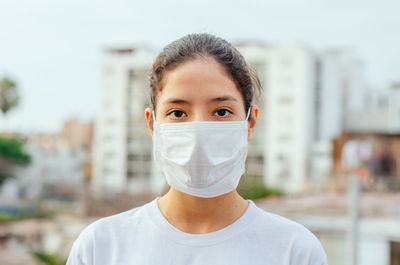 Portrait of teenage girl wearing mask