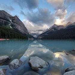 Scenic view of lake and mountains against sky