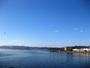 Scenic view of sea against blue sky