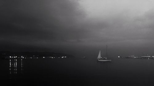 Sailboats sailing in sea against sky