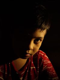 Close-up portrait of boy looking away