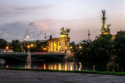 View of bridge over river at night