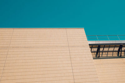 Low angle view of building against clear blue sky