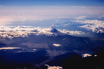 High angle view of snowcapped mountains against sky