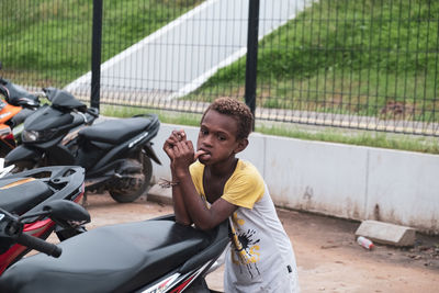 Side view of boy waiting her parents