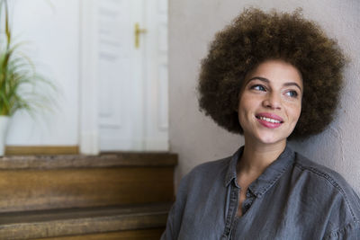 Smiling young woman looking away