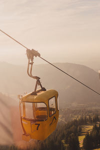 Overhead cable car against mountains