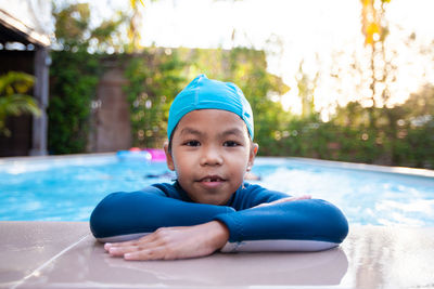 Portrait of smiling boy in swimming pool