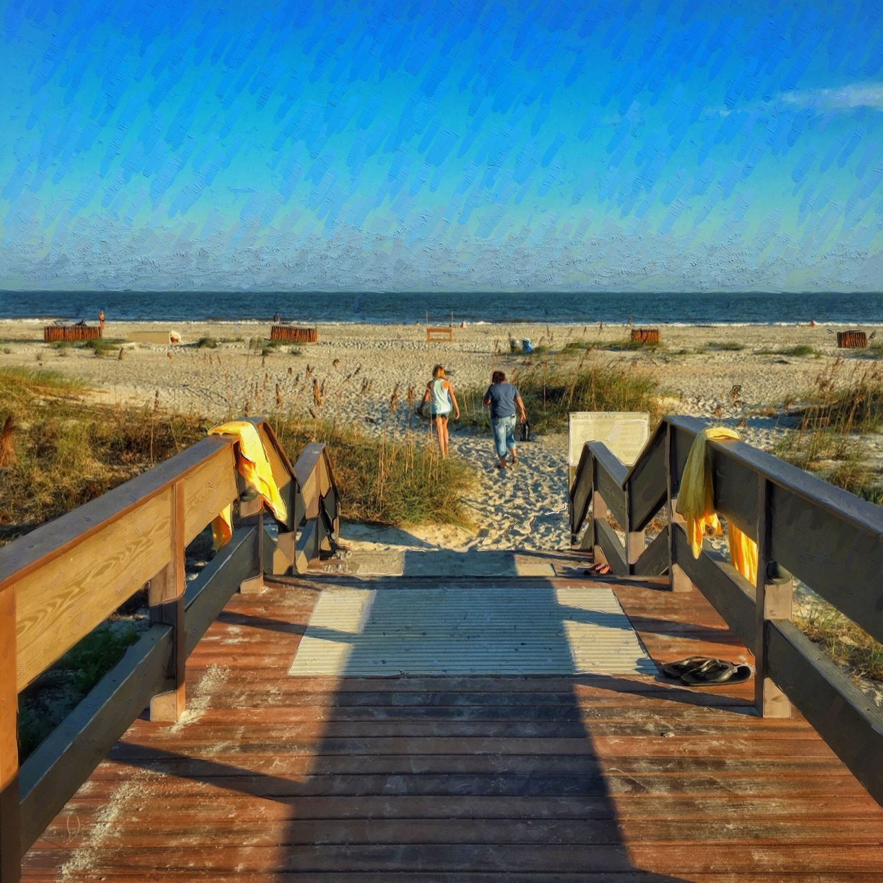 REAR VIEW OF PEOPLE WALKING ON SEA AGAINST SKY