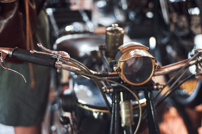 Close-up of motorcycle at garage