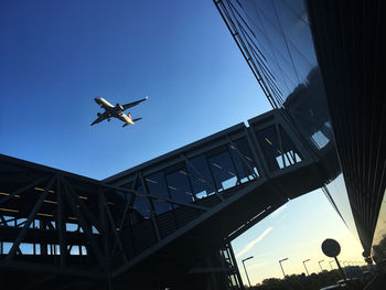 Low angle view of airplane against clear sky