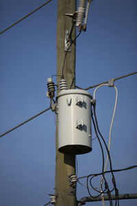 Electrical transformer and wires on an electrical pole