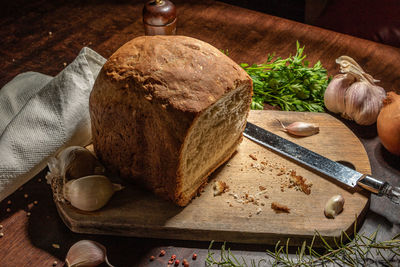 High angle view of bread on cutting board