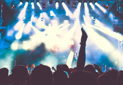 Crowd enjoying in music festival at night