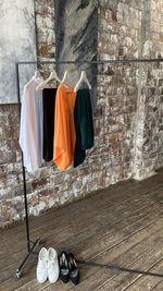 Clothes drying on table against wall